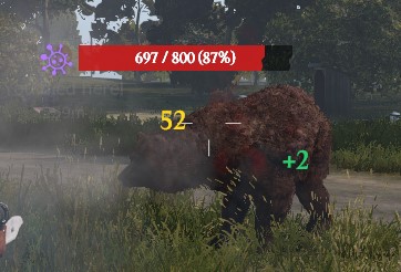 Un oso con su barra de vida (697 / 800, 87 %) y el icono de veneno; el impacto marca 52 en amarillo y el robo de vida +2 en verde